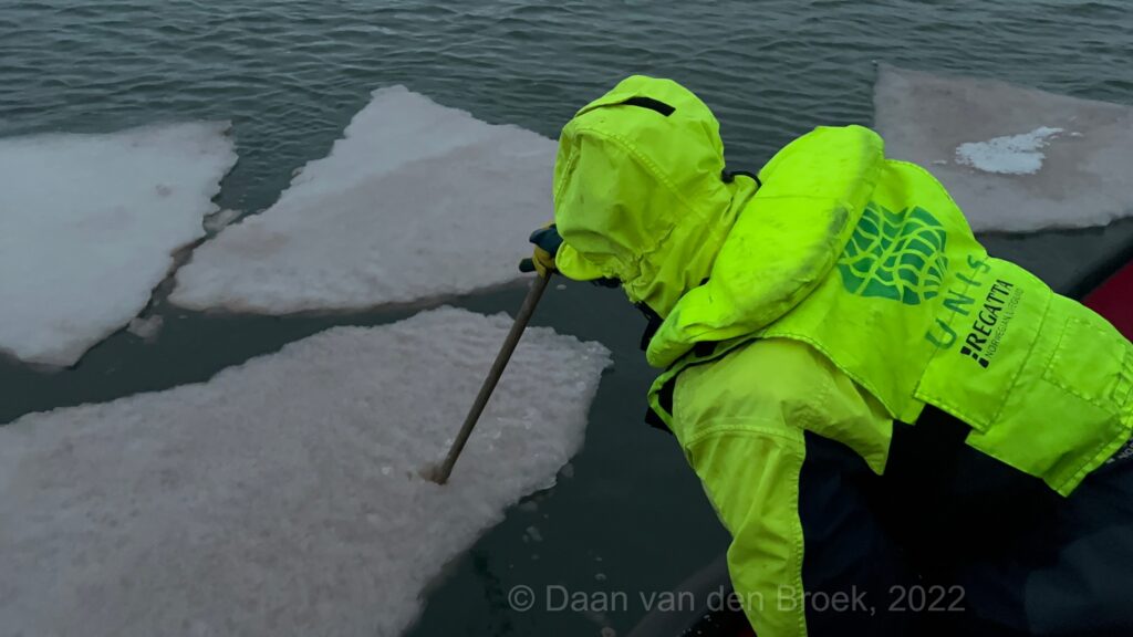 On the small boat, sampling some ice - scientific cruise - study in Svalbard - study at unis