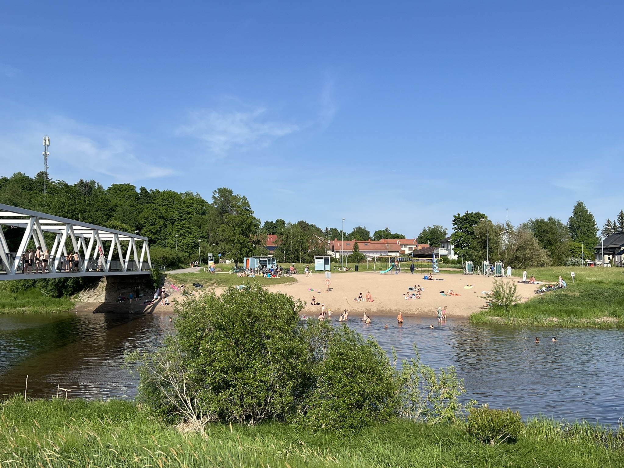 People cooling down in the Vantaa river on June 1st. Record hot days - May & September, Finland